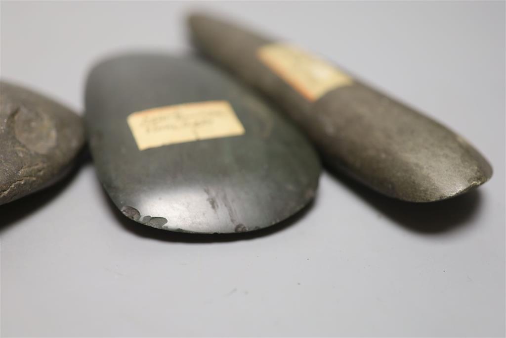 A group of stone adze hand tools, three 19th century Papua New Guinea, each labelled New Guinea, collected before 1950,